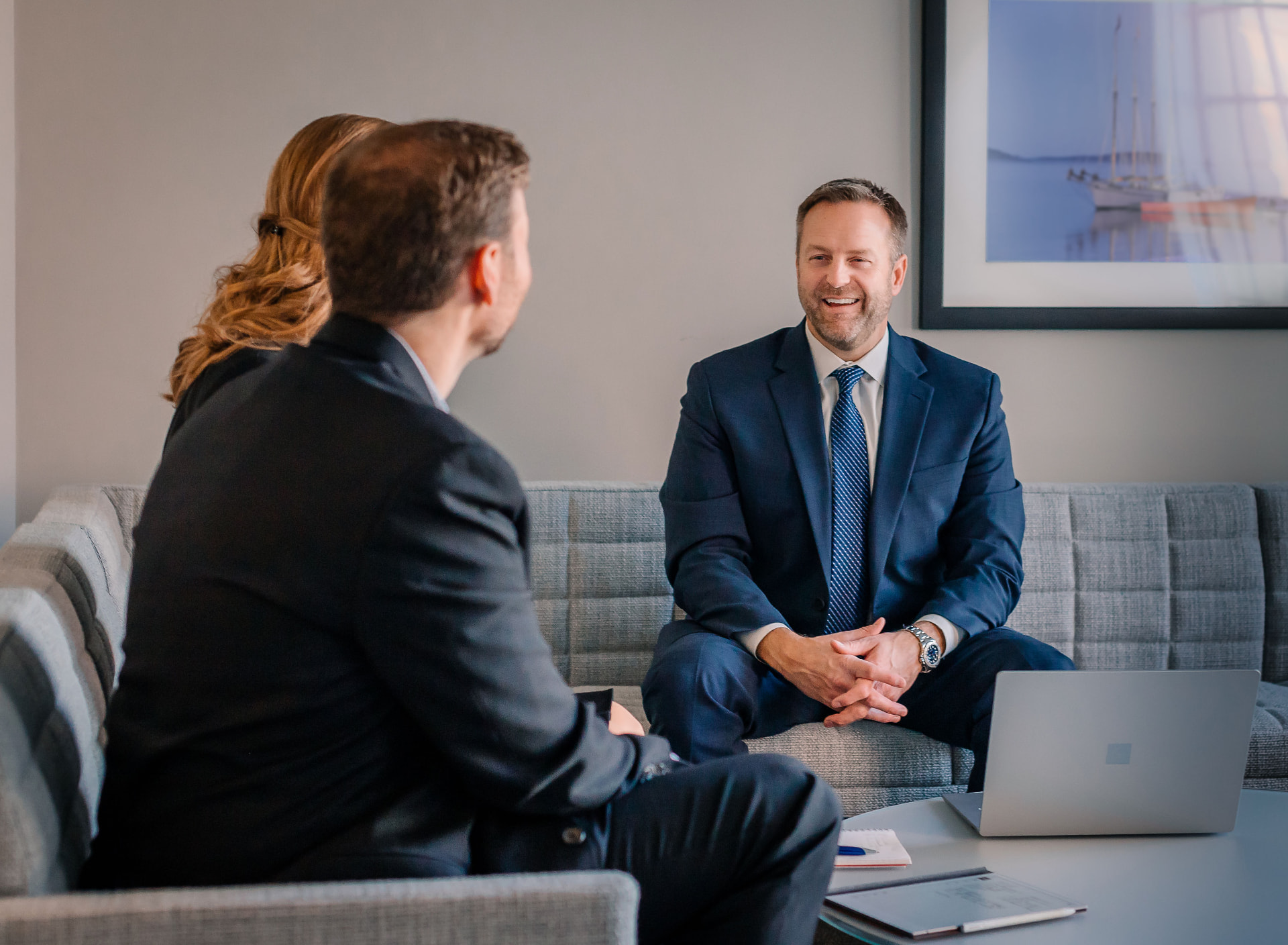 A Paulson Wealth advisor meeting with clients in the office